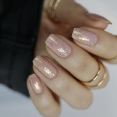 subtle gold shimmer manicure