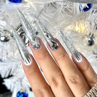 Manicure with chrome elements and snowflake nail art