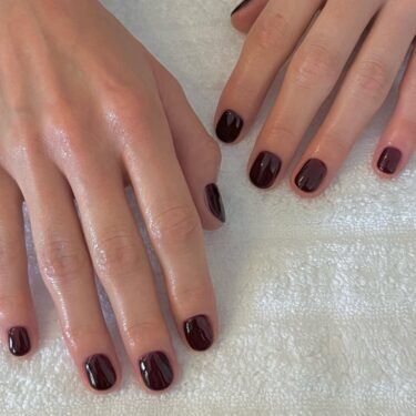 A manicure with espresso brown polish