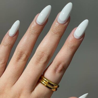 A reverse French manicure with white polish