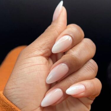 Almond nails with pink and white ombre design