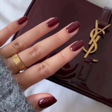 Short square nails with burgundy polish