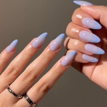 A lilac French manicure