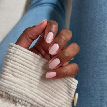 Short nails with light baby pink nail polish