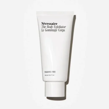 Nécessaire The Body Exfoliator in a minimalist white squeeze tube, a dual physical and chemical body exfoliator featured in a roundup of the best body exfoliators.