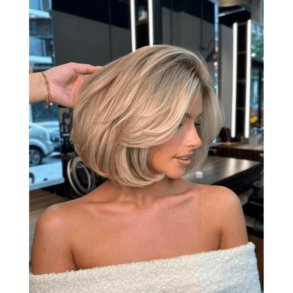 A side profile of a woman with old-money blonde bob
