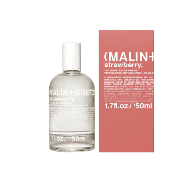 Malin+Goetz Strawberry Eau de Parfum bottle and coral box, featured in a roundup of the best berry perfumes.