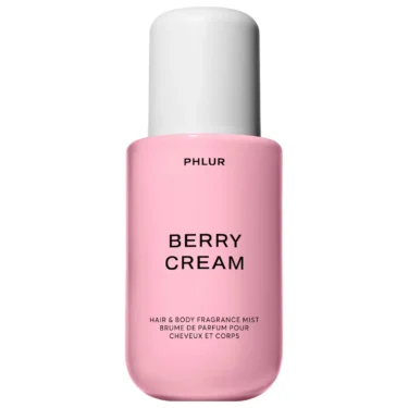 PHLUR Berry Cream hair and body fragrance mist in a pink bottle, featured in a roundup of the best berry perfumes.