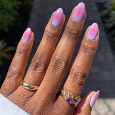 Manicure with pink and purple aura design