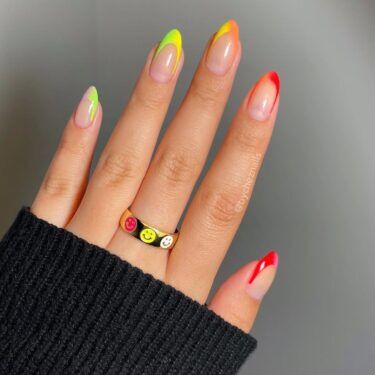 Neon rainbow colored French manicure
