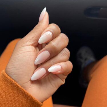 Almond nails with light pink and cream colors
