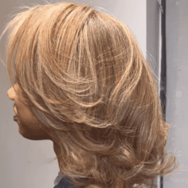Golden blond hair with layered cut
