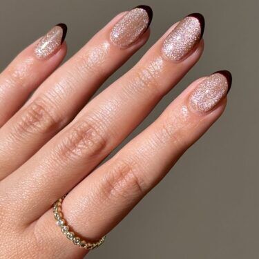 Shimmery manicure with dark French tips