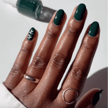 Dark green manicure with nail art.