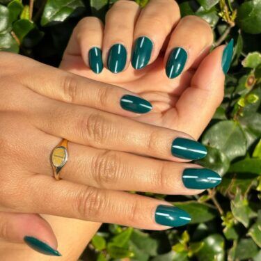 Dark green nails with simple line design