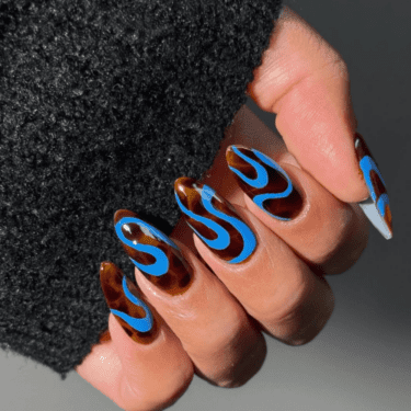 Manicure with blue wave design