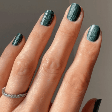 Dark green textured nails