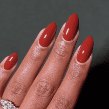 Almond nails with brick red polish