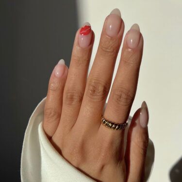 bare manicure with kiss lip art