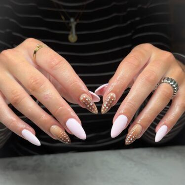 Deer print manicure and pink accent nails