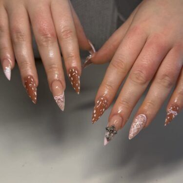 Deer print and coquette nails