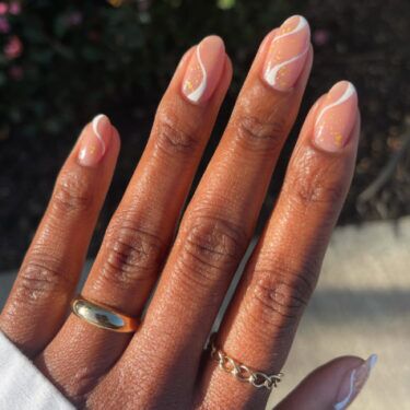 nude swirl nails