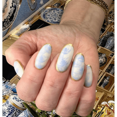 close-up of matte marble nails