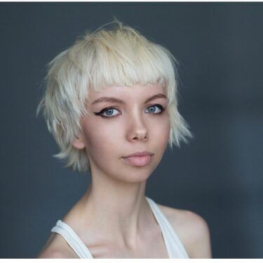 A woman with a short shag hairstyle