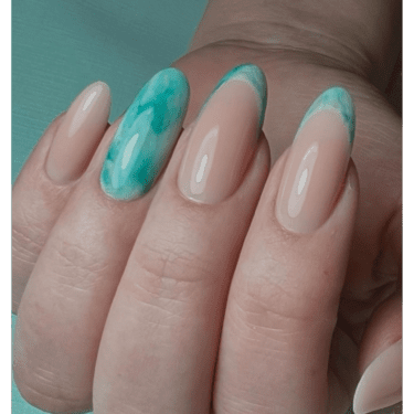 close-up of teal marble nails